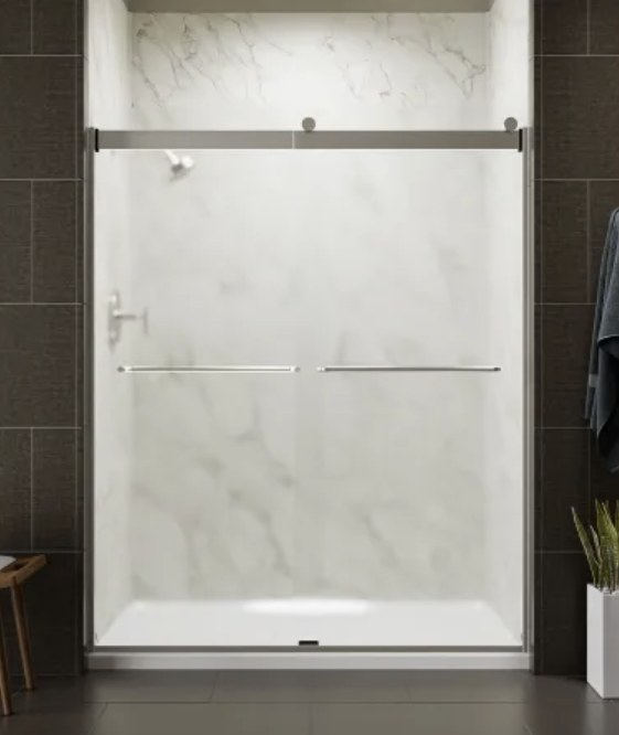 Marble-look walk-in shower with chrome glass enclosure