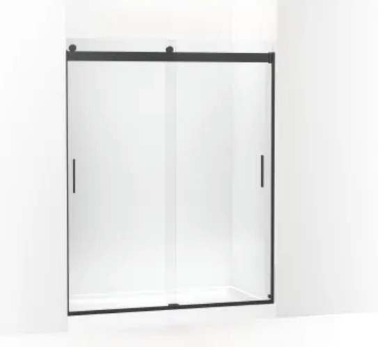 Modern matte black sliding shower door on white surround